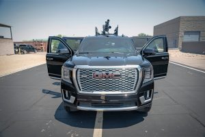 Armored GMC SUV with mounted weapon