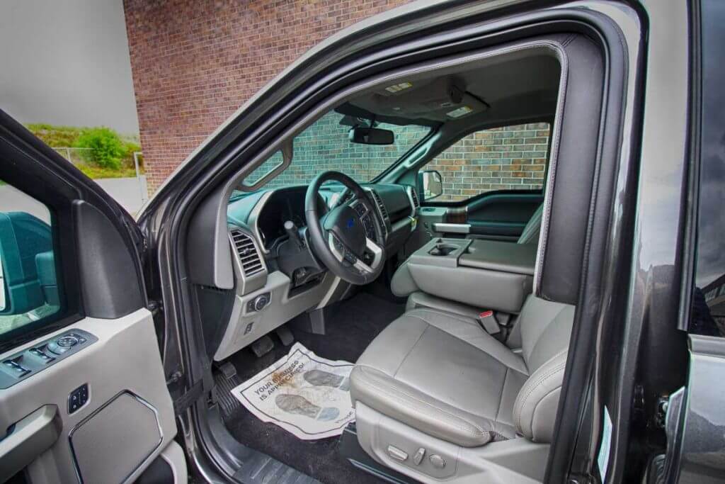 TAG Interior of bulletproof Ford F-150 truck cab with hydraulic steering