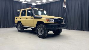 Yellow armored Toyota S U V