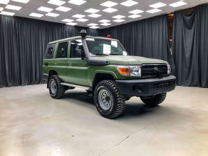 Front shot of green armored SUV