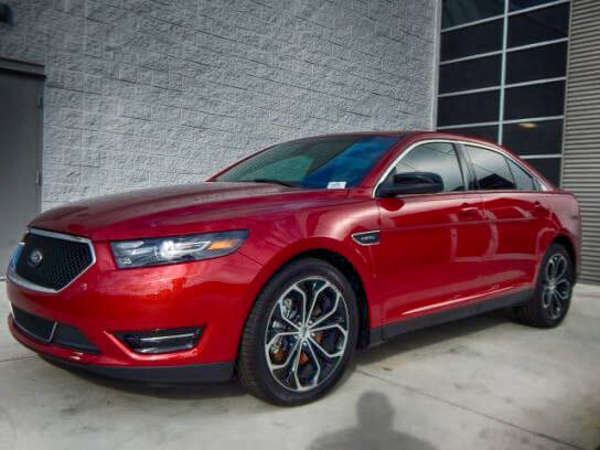 TAG Picture of red armored Ford Taurus sedan with run-flat tire systems