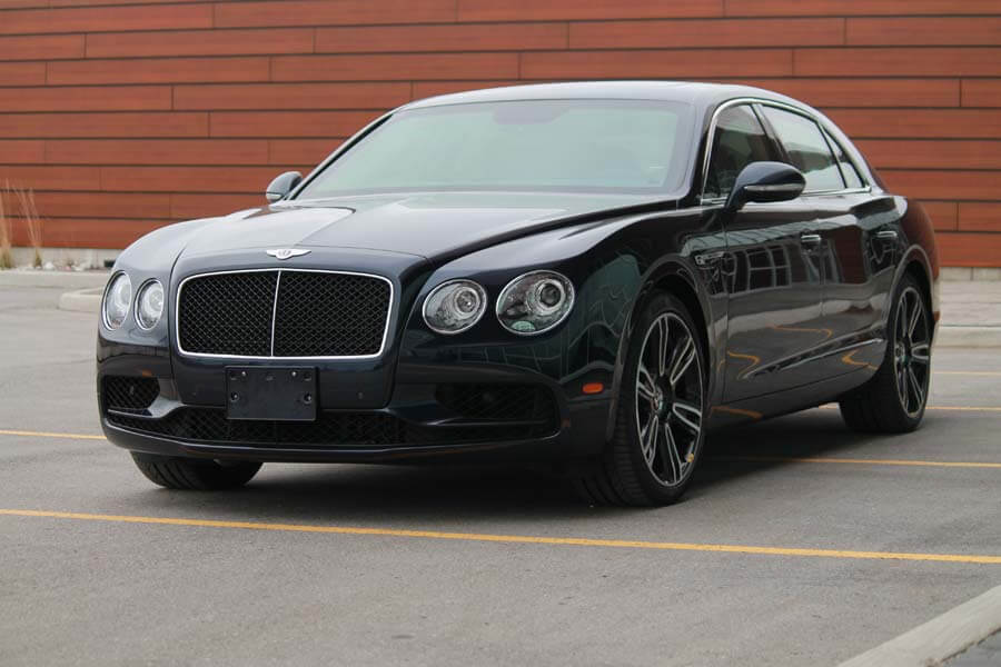 TAG Armored Bentley Flying Spur Series Picture of black armored Bentley Flying Spur sedan with blast protection