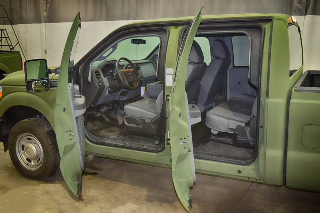TAG Interior of green bulletproof Ford F-350 truck