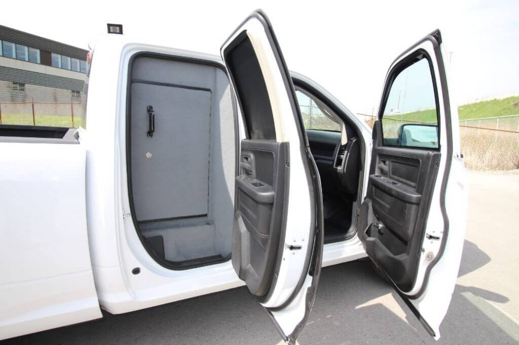 TAG Armored Dodge Ram 1500 White armored Dodge Ram 1500 interior with bulletproof glass