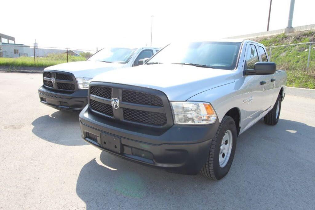 TAG Armored Dodge Ram 1500 Front Corner Side View Two Trucks