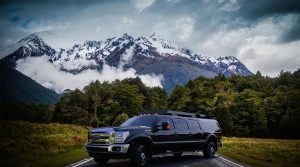 TAG Tactical Utility Vehicles Ford Mobile Commander Front Side Corner View Background Mountain Forest View