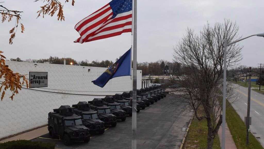 TAG APCs With Flag Line Armored Trucks Outdoors