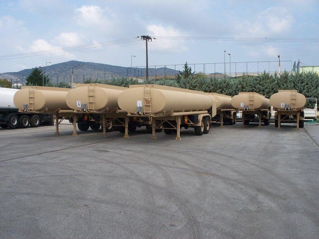 Armored Group Unarmored Water/Fuel Tank Trailers multiple parked