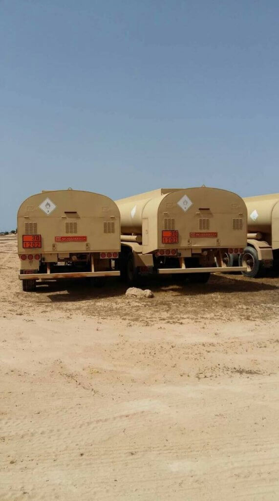Armored Group Unarmored Water/Fuel Tank Trailers three parked on dirt
