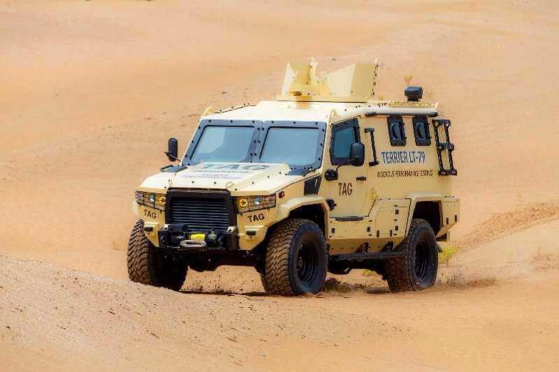 The Armored Group, LLC Introduces its Newest Vehicle, the Terrier Armored Personnel Carrier Driving Dessert Driver Corner Angle View